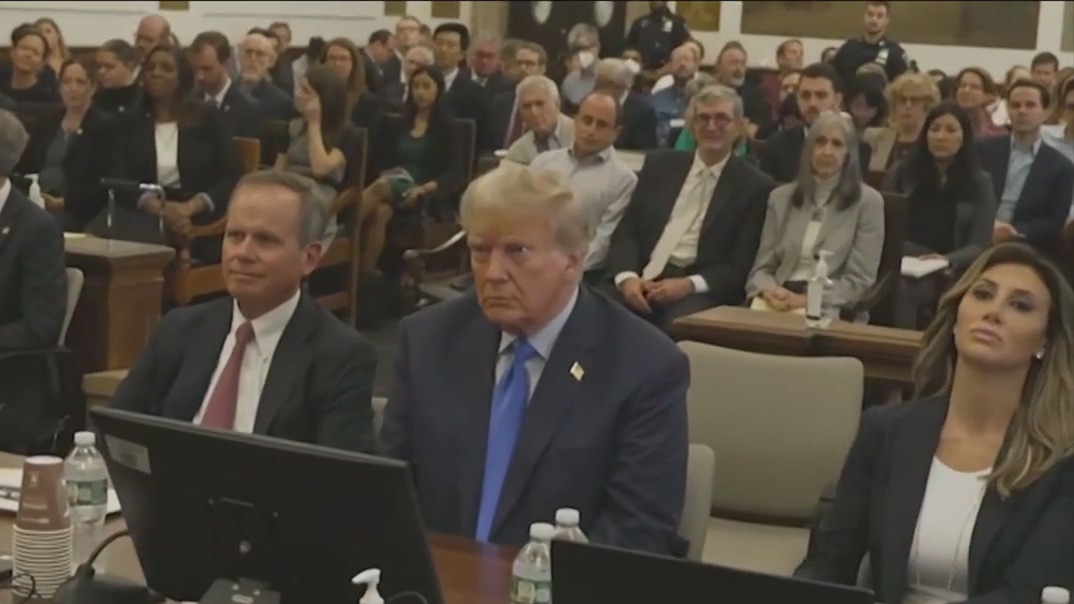 Donald Trump denounces case as 'scam' as he arrives for a New York trial over his business practices