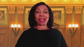 Justice Joy Cunningham reacts to retaining her seat on the Illinois Supreme Court