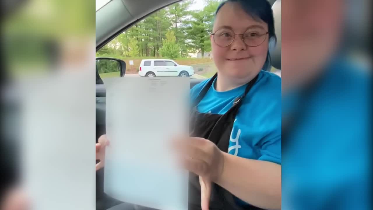 Woman with Down's syndrome celebrates earning first check