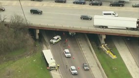 Semi-truck wrecks on Stevenson Expressway, container overturns