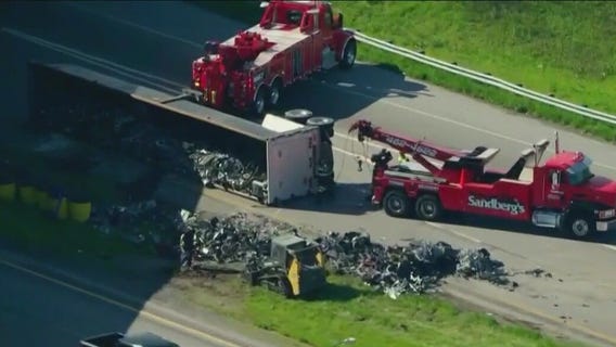 Scrap metal truck overturns on Indiana highway