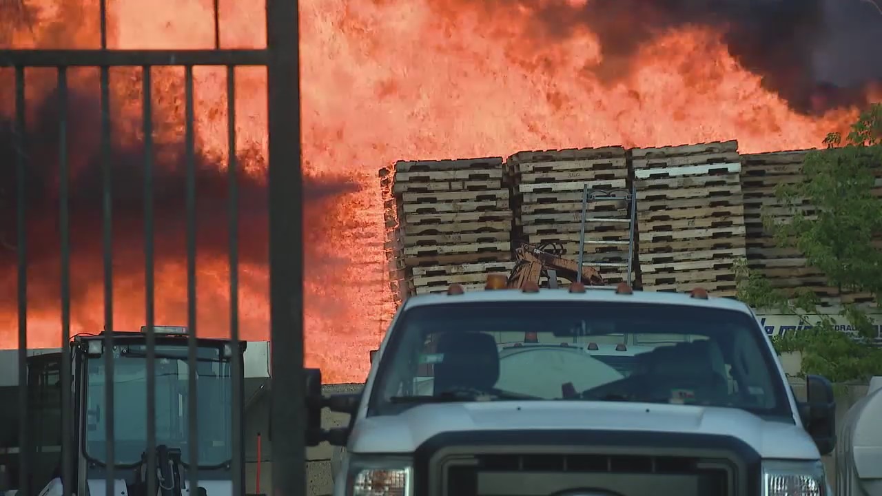Massive fire erupts at West Town pallet yard