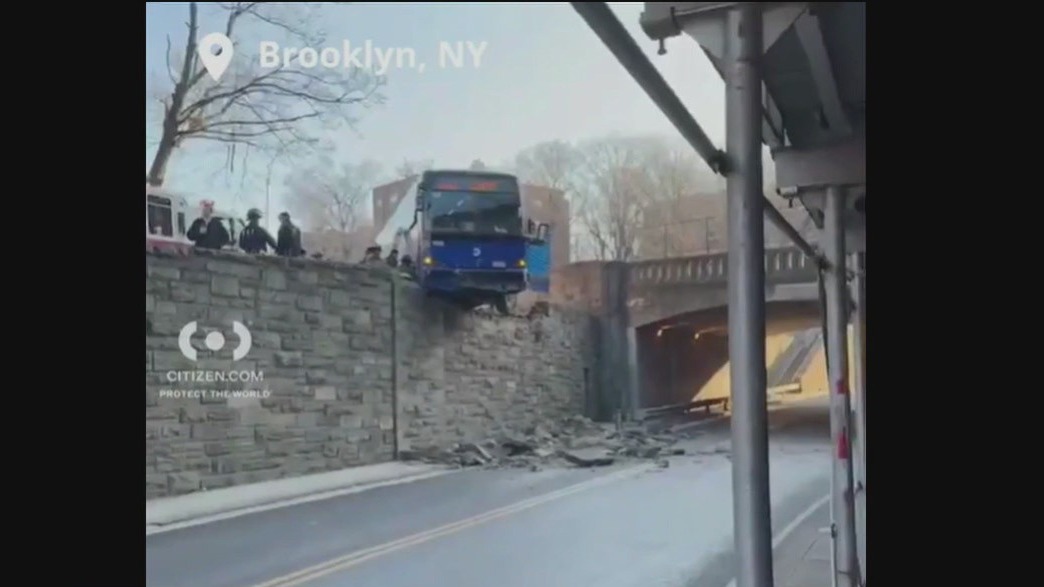 Bus hanging off overpass near Henry Hudson Parkway