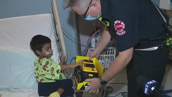 Chicago firefighters give holiday gifts to kids sick in the hospital