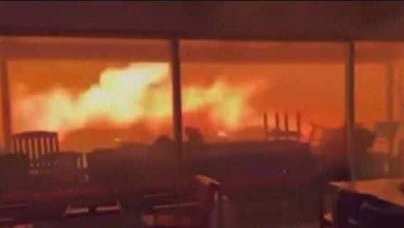 Thousands flee from out-of-control fires in the LA area