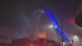 Firefighter injured in massive blaze at South Side furniture store