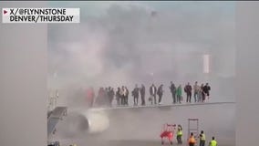 Plane at Denver International Airport catches fire