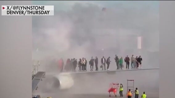 Plane at Denver International Airport catches fire
