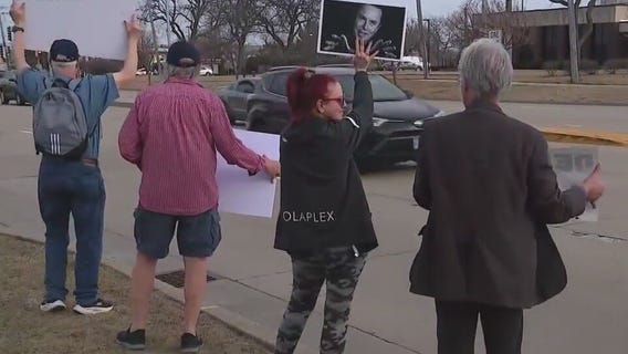 Protesters rally at Schaumburg Tesla dealership against Elon Musk
