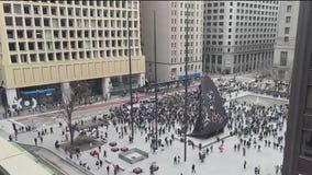 Protesters rally against President Trump's policies in downtown Chicago