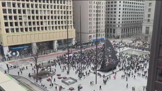 Protesters rally against President Trump's policies in downtown Chicago