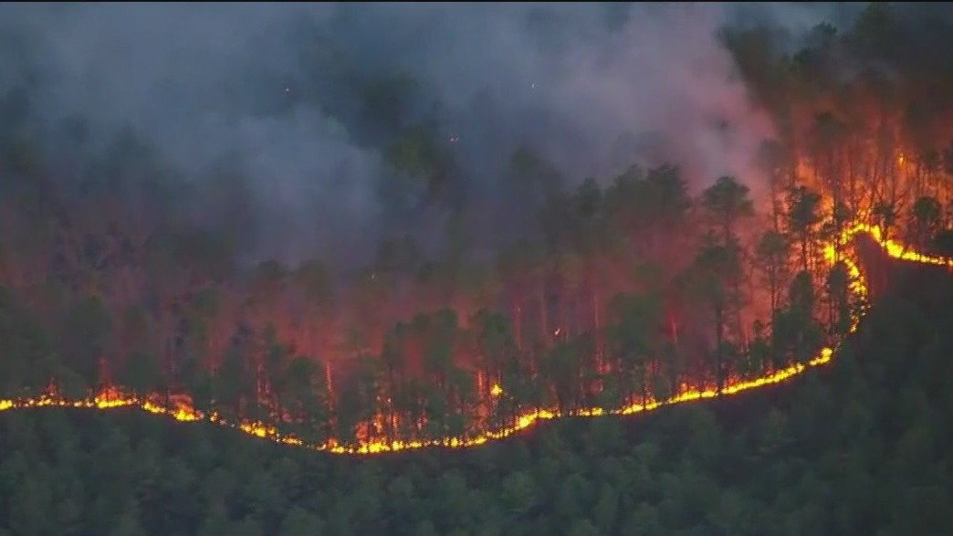 Across America: Massive wildfire still burning