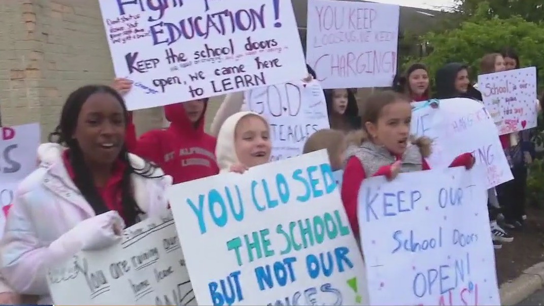 Students, families rally against Catholic school closure in Prospect Heights