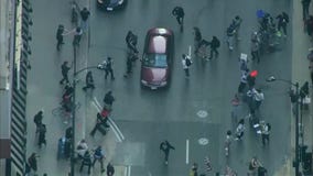 Video shows car driving through anti-ICE protesters in Chicago