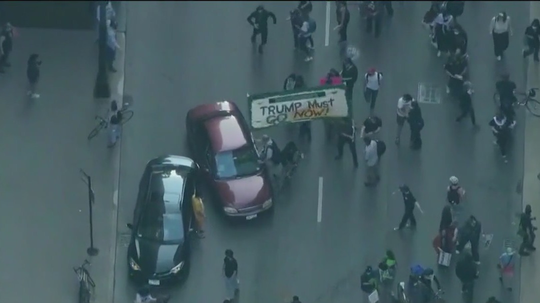 Chicago ICE protests: Woman hit by car that drove into crowd, police say