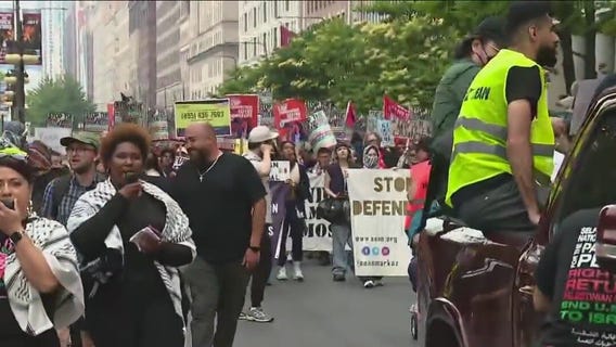 Anti-ICE demonstrators march in downtown Chicago