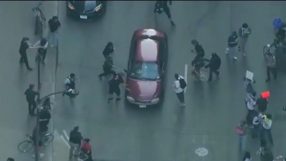 Woman charged with driving into Chicago anti-ICE protest crowd, injuring 1, police say