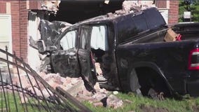 4 hurt after truck slams into South Side building