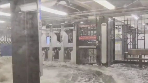 East Coast flooding fills New York subway, kills 2