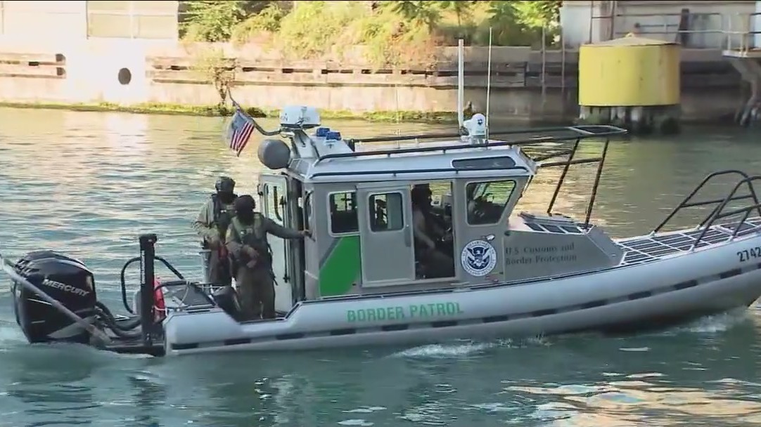 Armed Border Patrol agents on Chicago River