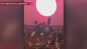 Man arrested after rushing church stage, church member takes him down with music stand