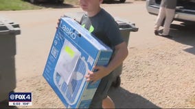 Volunteers brave heat to deliver things to those in need