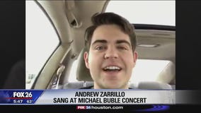 Michael Buble passes microphone to Klein Oak graduate