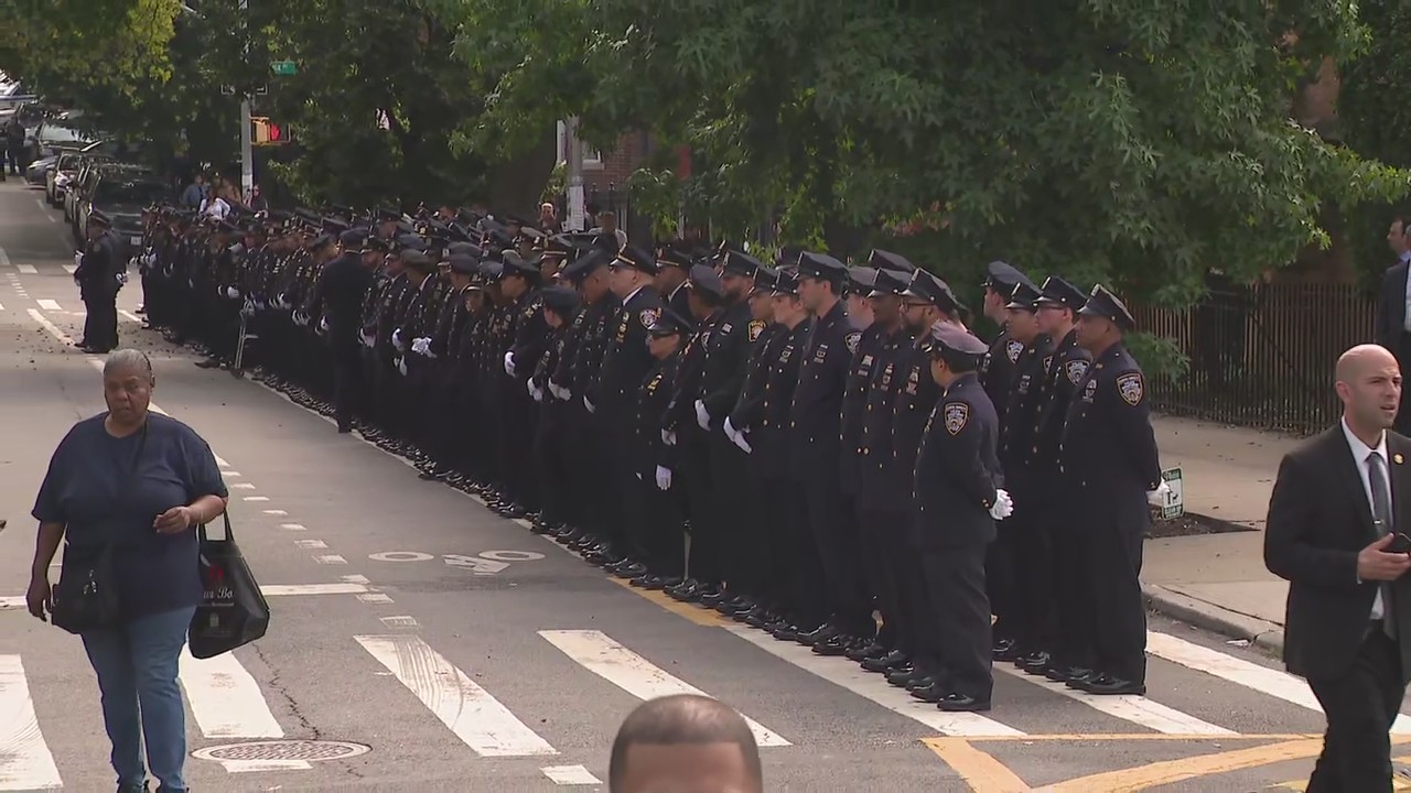 Officers lined up outside of funeral for NYPD Officer Islam