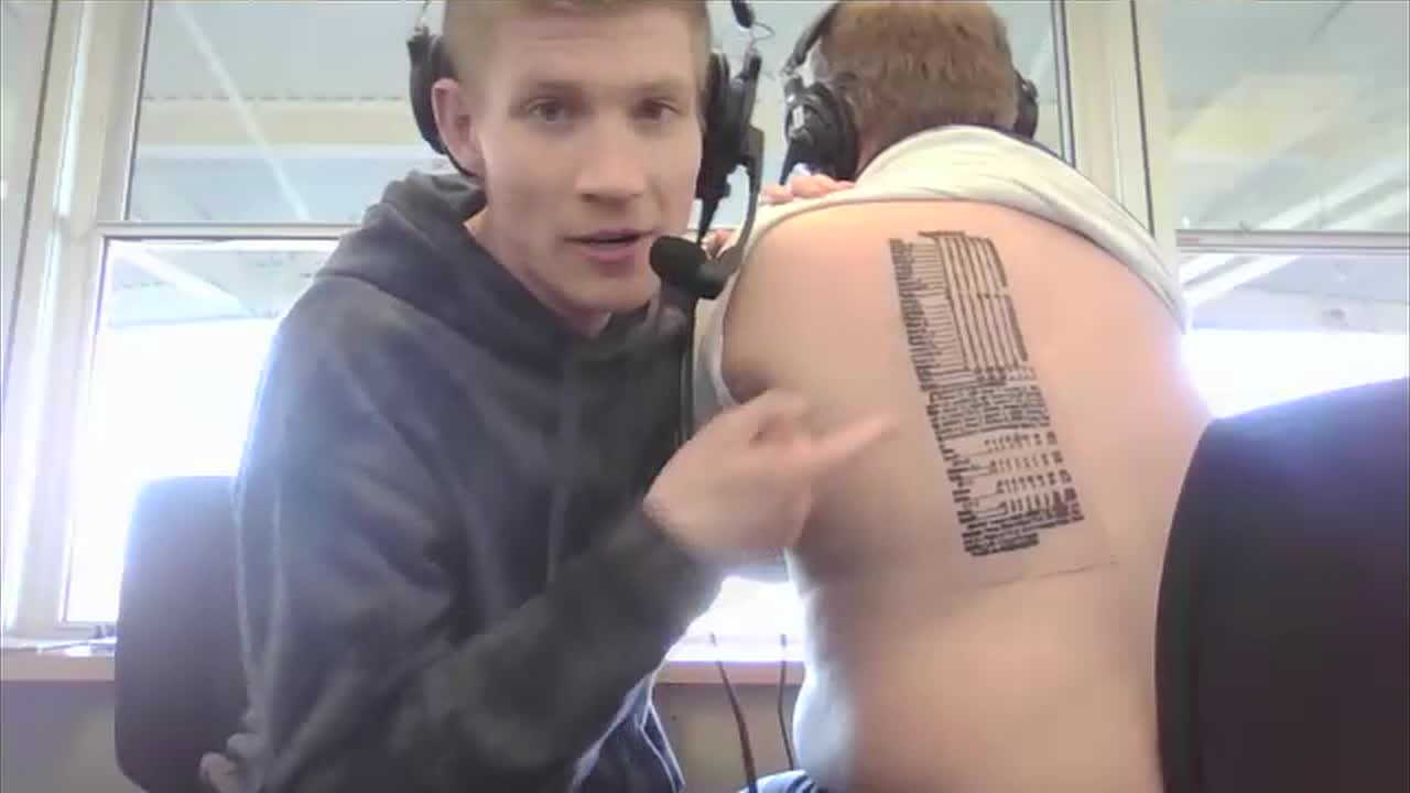 Ticket host Sean Bass shows off Rangers WS tattoo