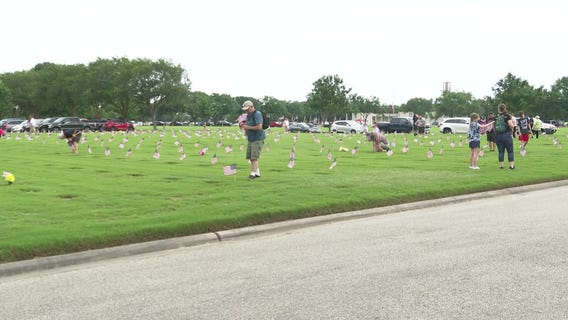 Residents place flags for fallen veterans on Memorial Day