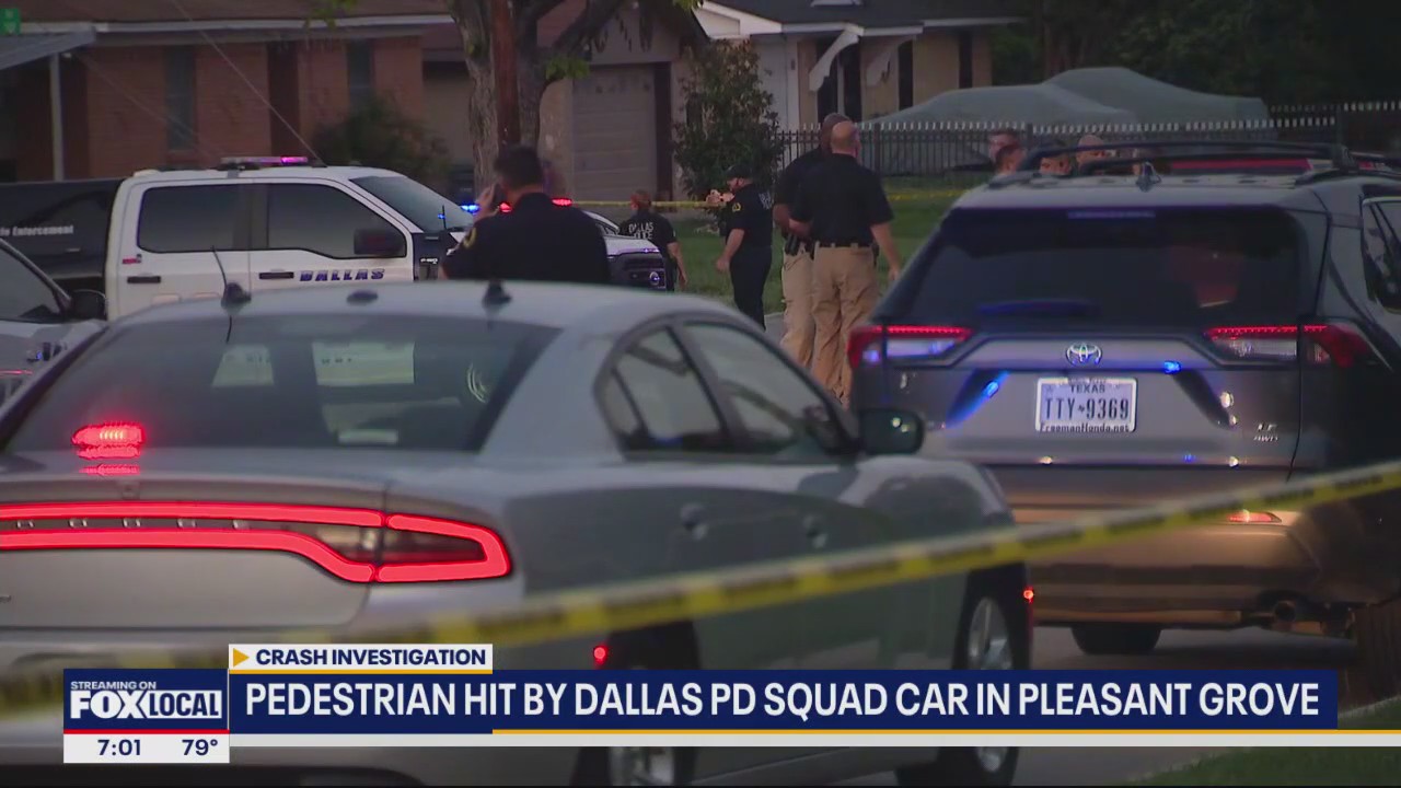 Woman hit by Dallas police squad car