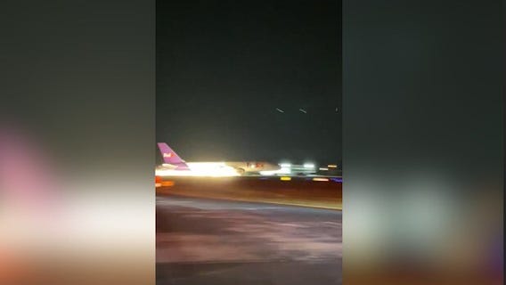 FedEx plane crash lands at airport, sparks