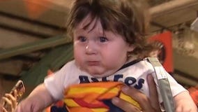 Astros baby lifted into the air after win