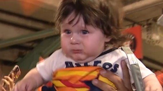 Astros baby lifted into the air after win