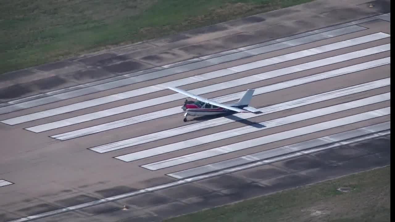 Small plane lands on its belly at Dallas airport