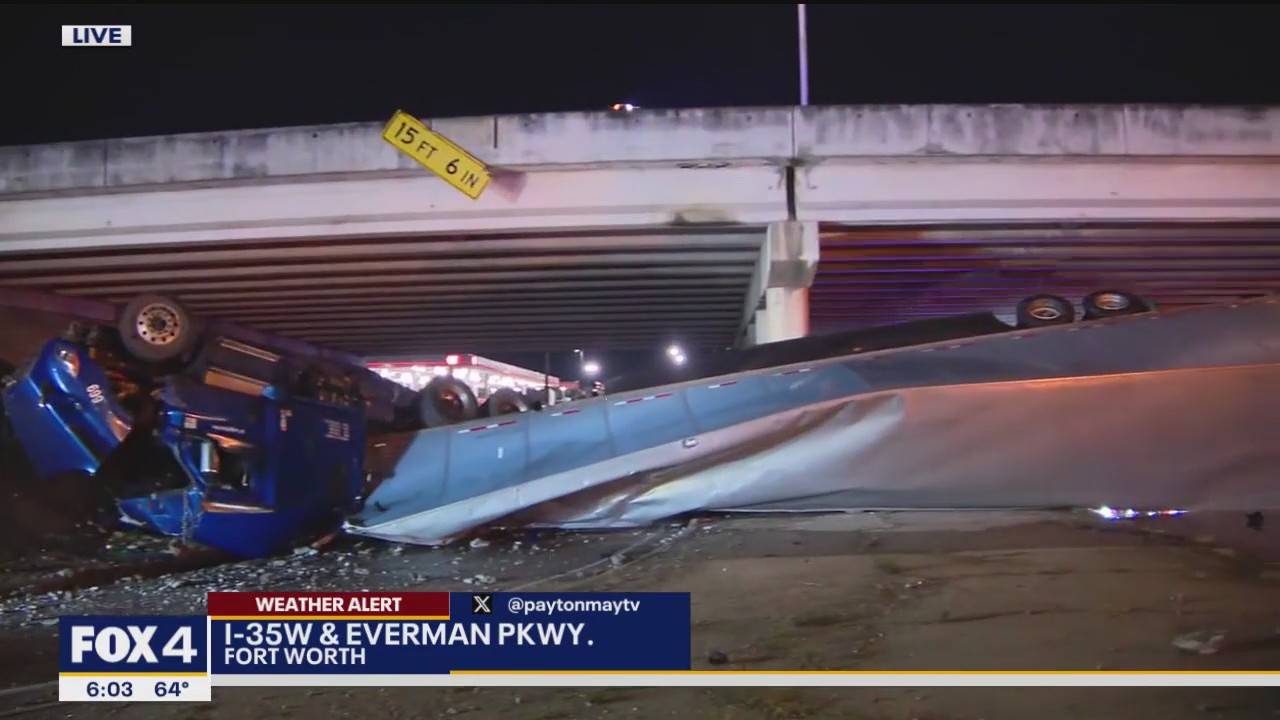 Semi-truck dangles over I-35W after crash amidst rain
