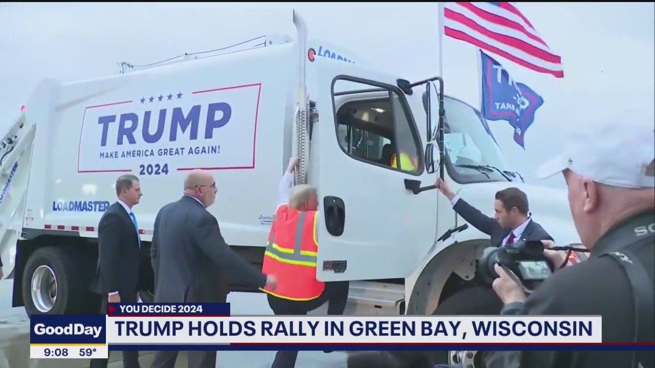 Trump shows up to rally in a trash truck