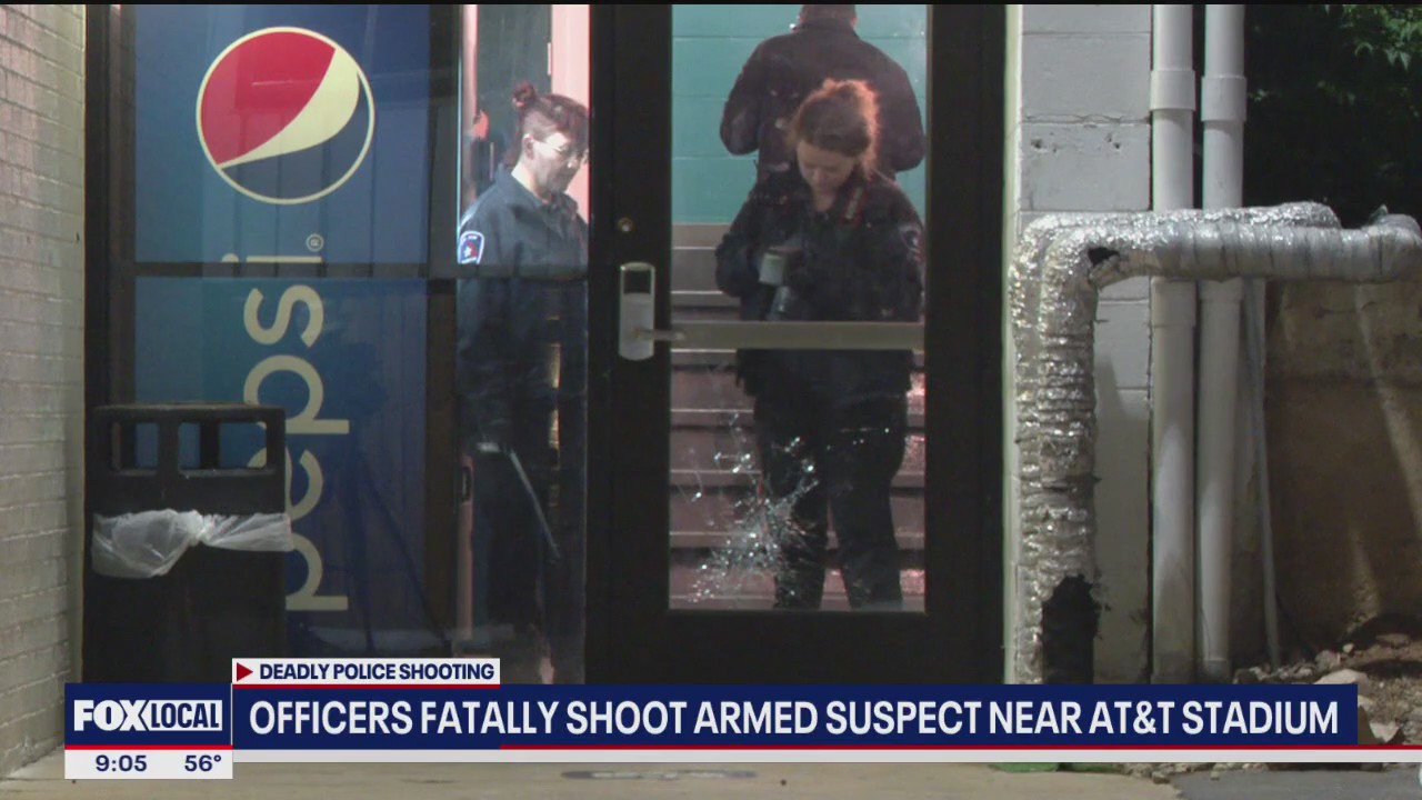 Police kill man holding motel guest at knifepoint