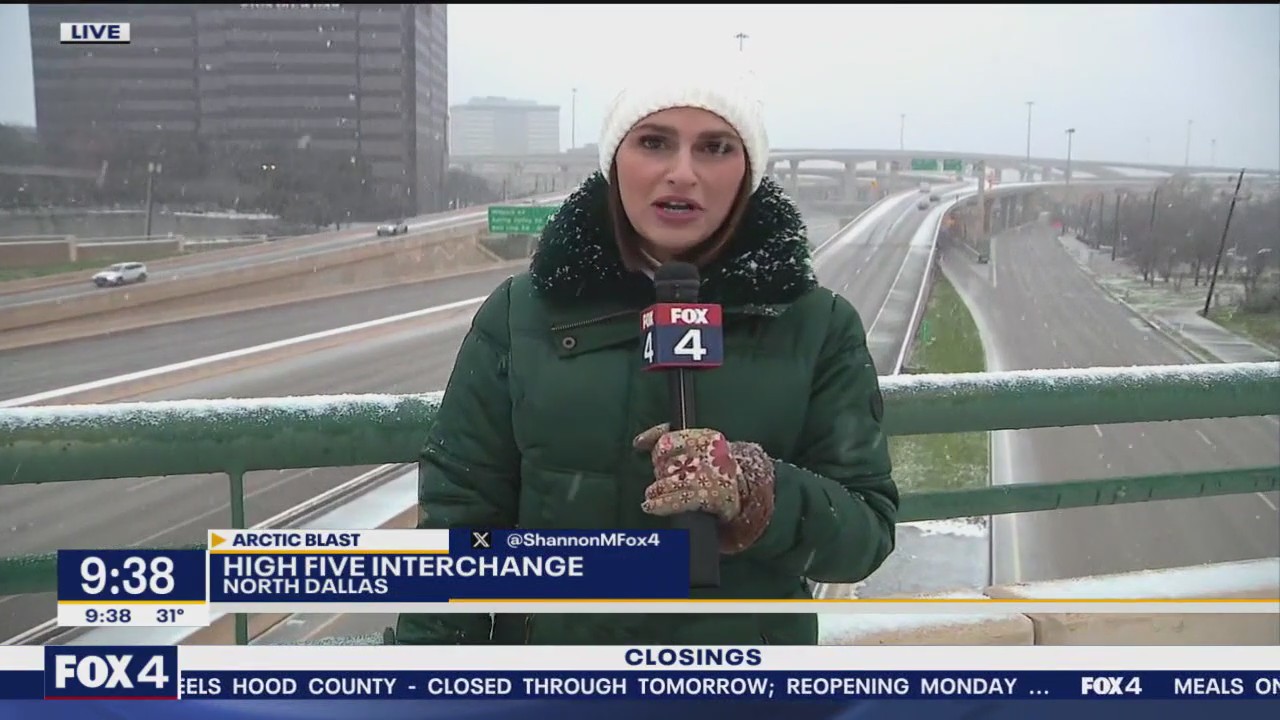 Snow falls on Dallas High Five Interchange