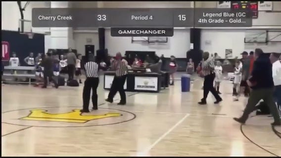 Referees fight each other during youth basketball game