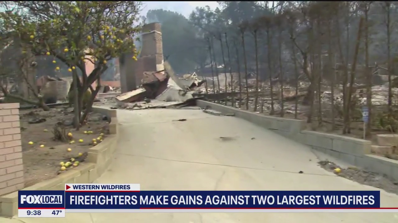 Firefighters make gains battling 2 largest wildfires