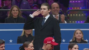 Barron Trump urges on cheering crowd