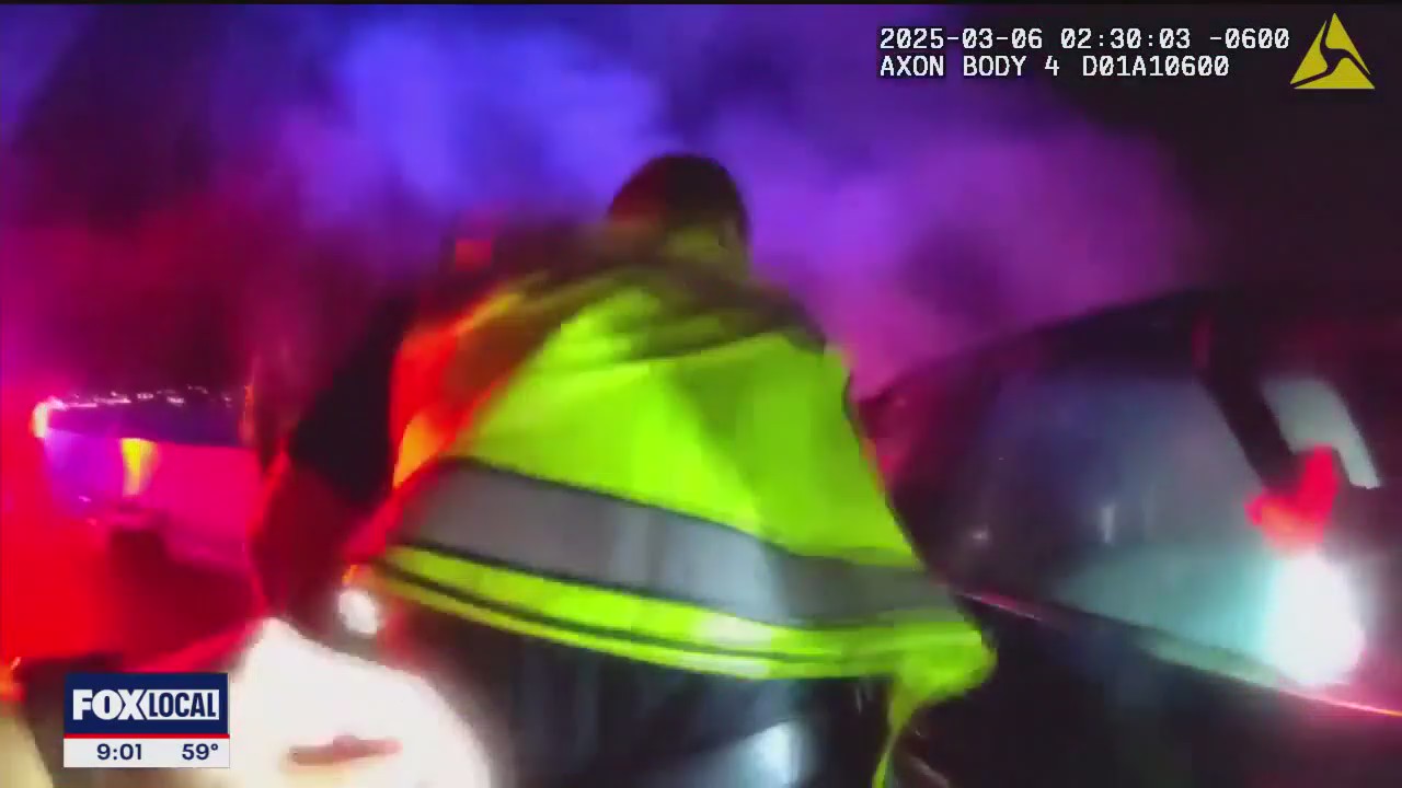 Officer rescues suspected drunk driver after wreck