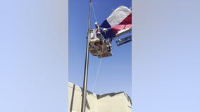 Crosby volunteer firefighters help replacing flags