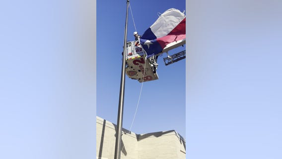 Crosby volunteer firefighters help replacing flags