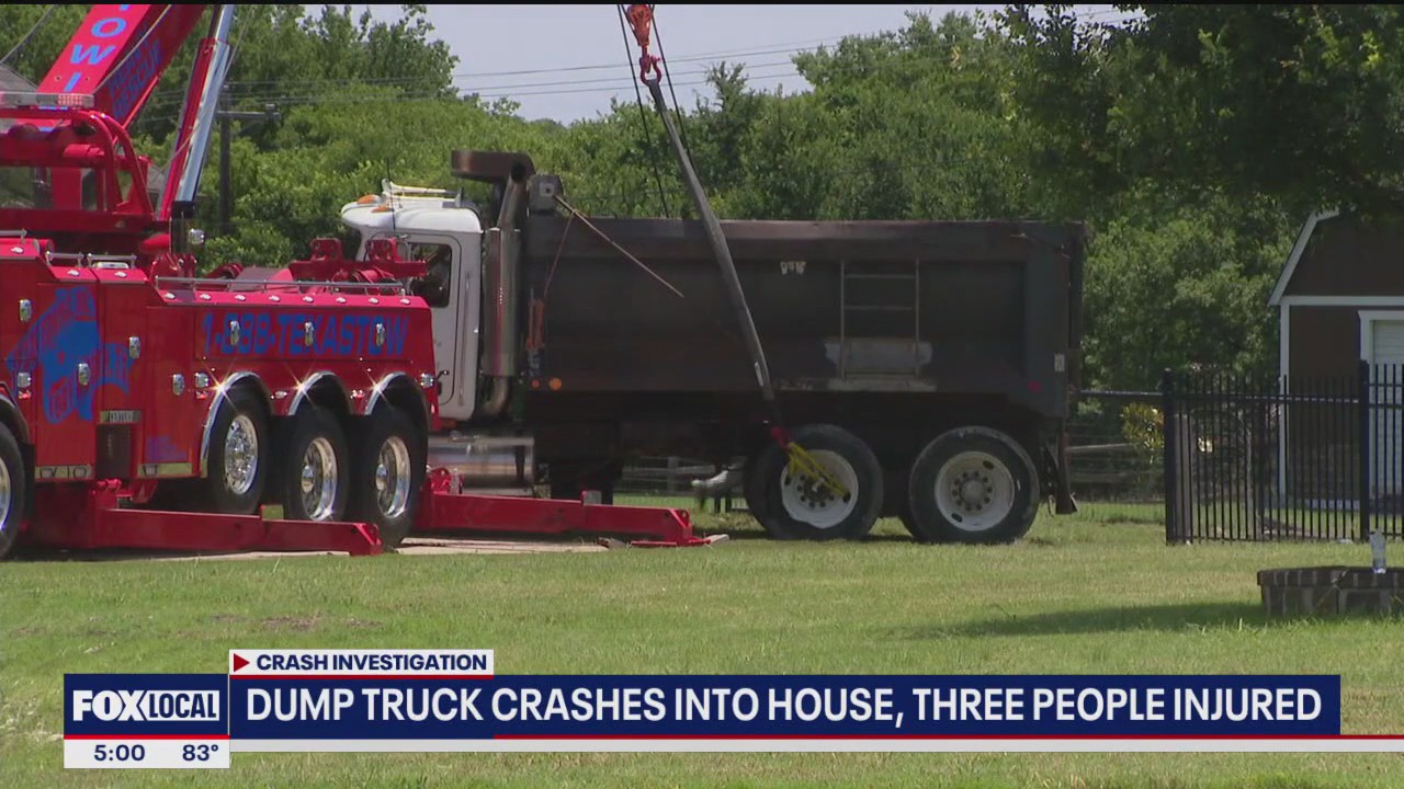 Overturned dump truck hits Haslet home after crash
