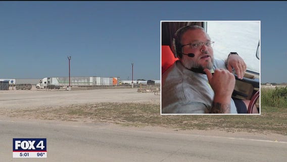 Murder suspect barricades herself in cab of semi-truck