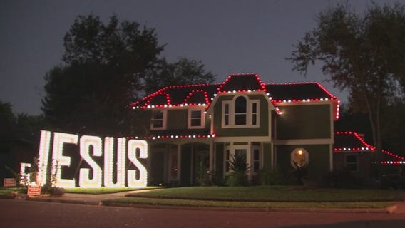 Richmond woman displays giant Jesus sign in front of her house
