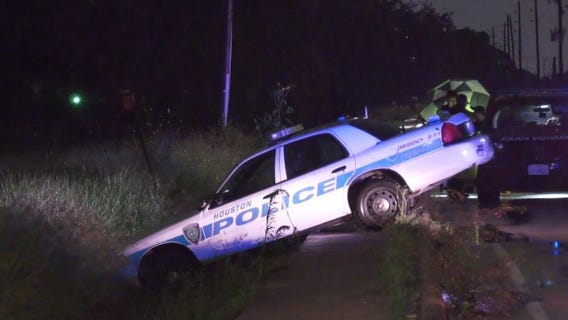 Heavy rain causes Houston police officer to crash while responding to call