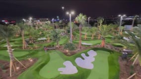 Checking out Pop Stroke, a place to eat, putt, and drink